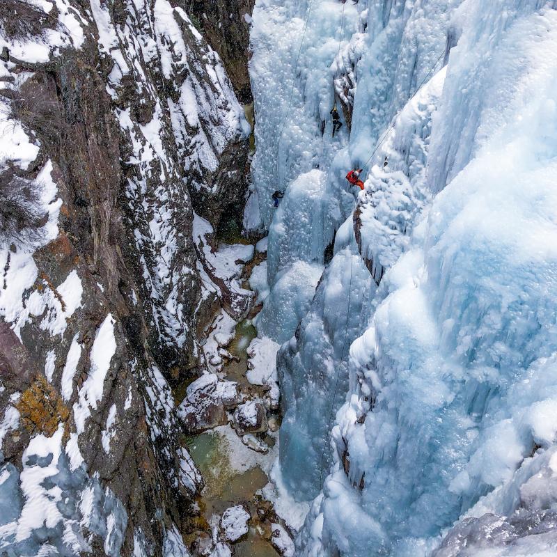 An ice climber rappels down the walls of the Ouray Ice Park. Photo by Laura Cardon.