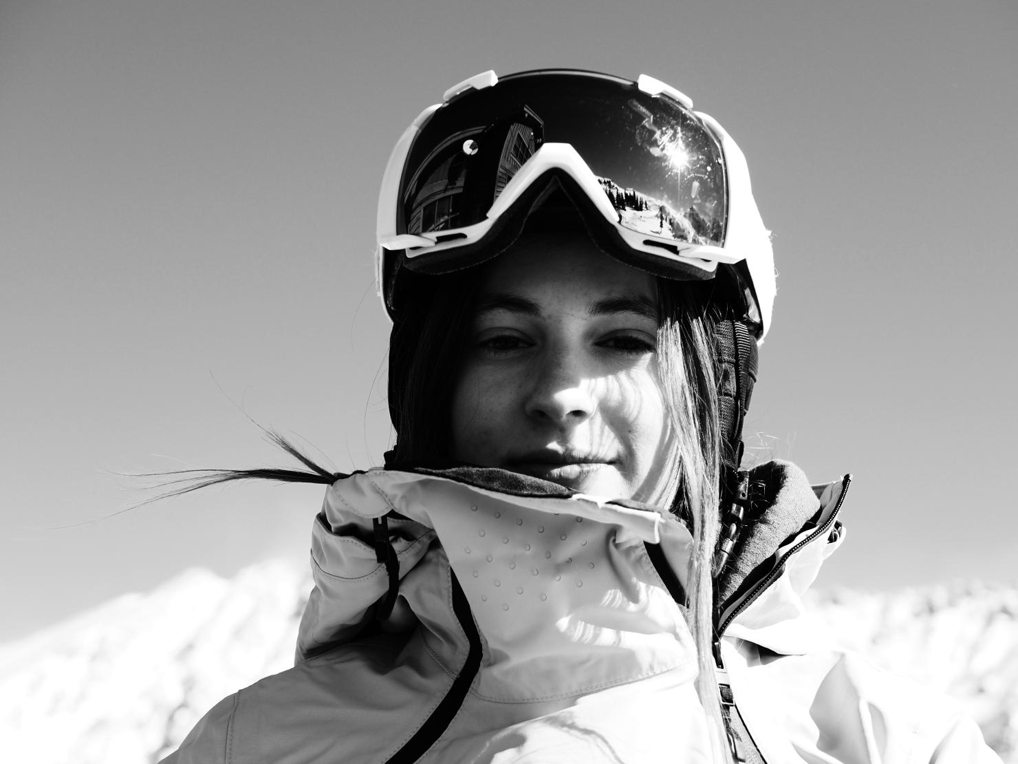 Lauren King headshot in ski goggles and jacket. 